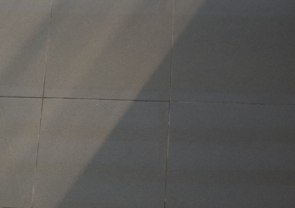 Tiled floor in diagonal sunlight