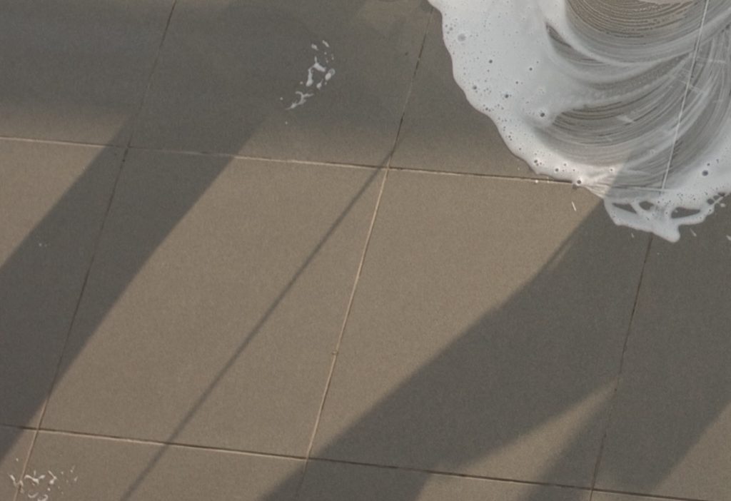 Foam spreading across a tiled floor