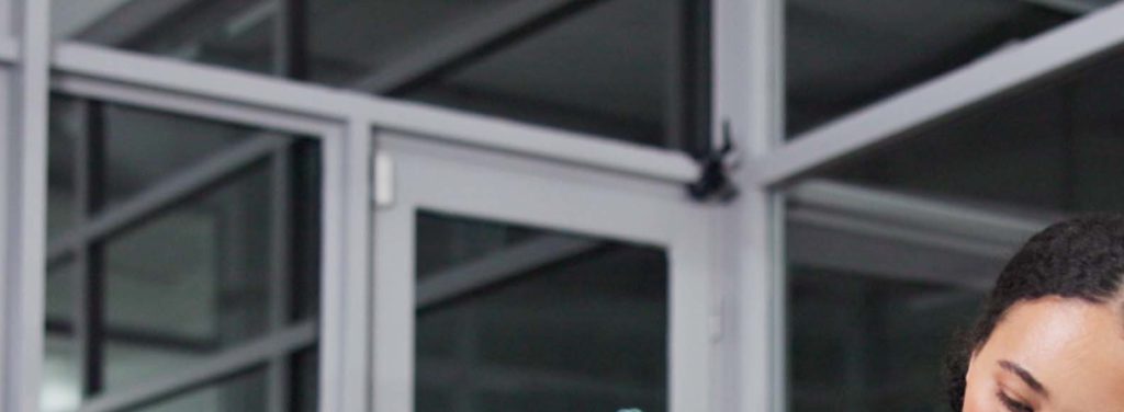 Cleaner at a glazed office door