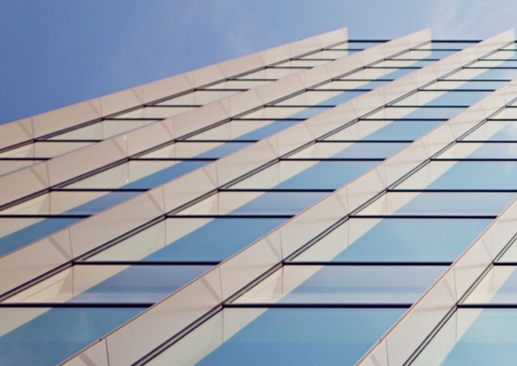 Glass office tower against the sky