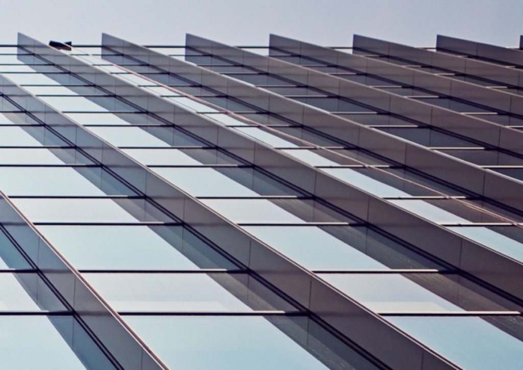 Glass tower facade seen from below